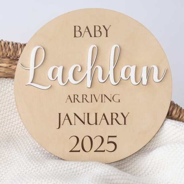 A wood announcement disc with the baby name Lachlan added with an acrylic insert and also including the month & year.