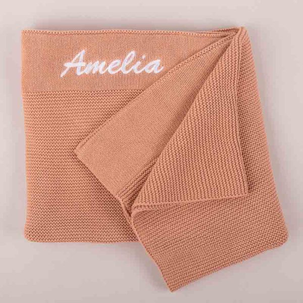 Dusty Peach Knitted Personalised Baby Blanket with Amelia Embroidered using white thread.