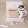 Baby Gift - Beige Knitted Blanket, Puppy Comforter and Shoes displayed in a box with ribbon.