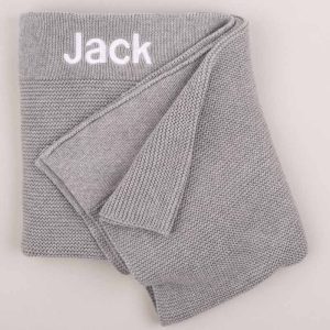 Personalised Grey Knitted Baby Blanket embroidered with boys name and Micro Block font.