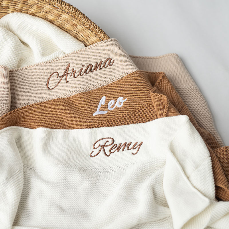 Three personalised knitted baby blankets unisex gifts.