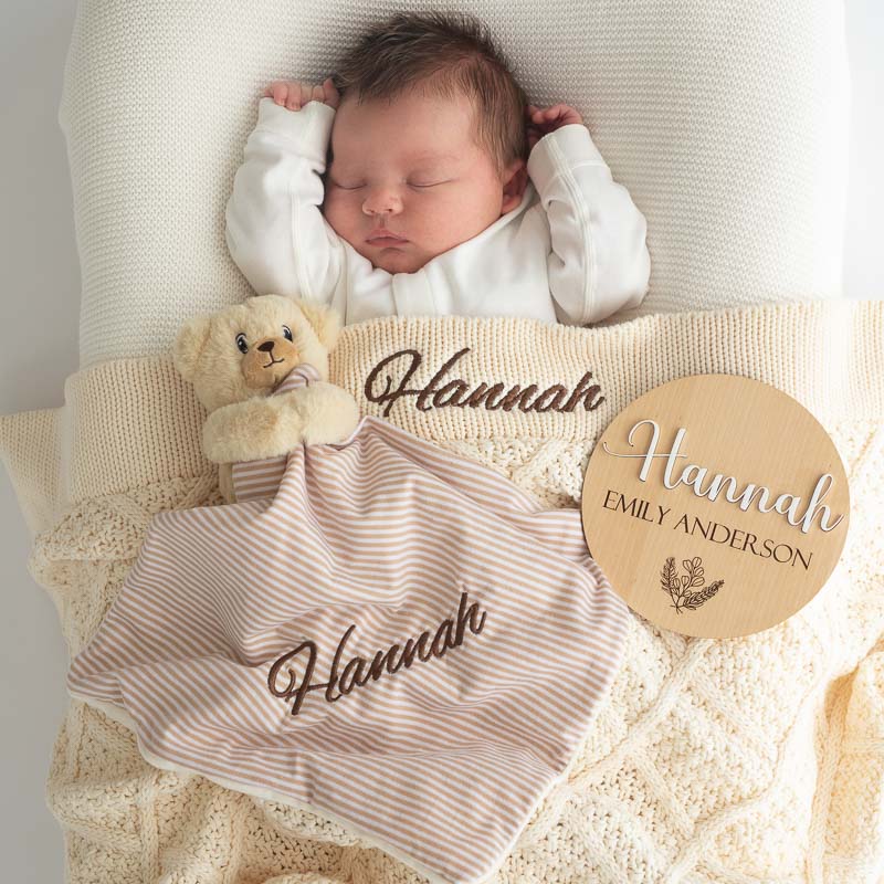 Personalised cream diamond knitted blanket, birth announcement disc and bear comforter newborn gift ideas.