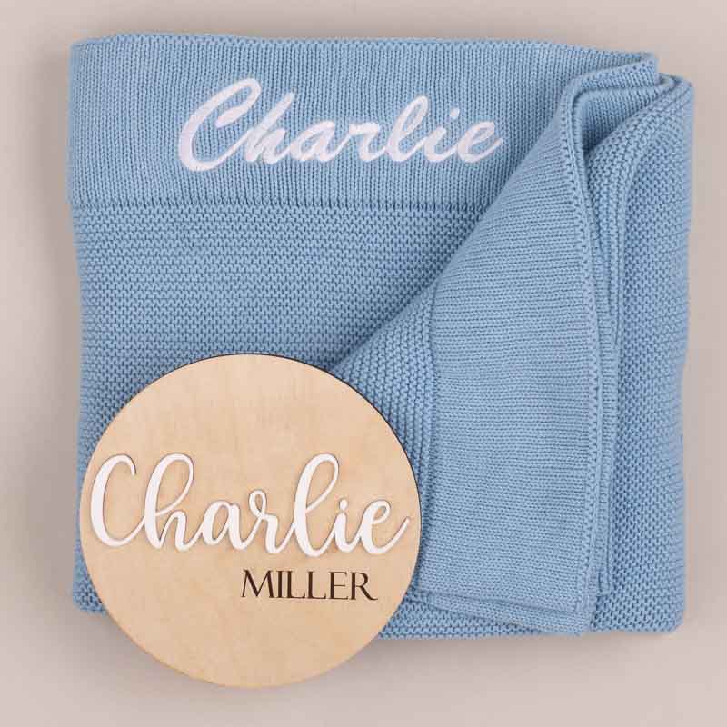 Personalised blue knitted blanket and baby name disc gift for boys.
