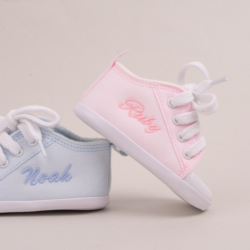Pink and blue personalised baby shoes.