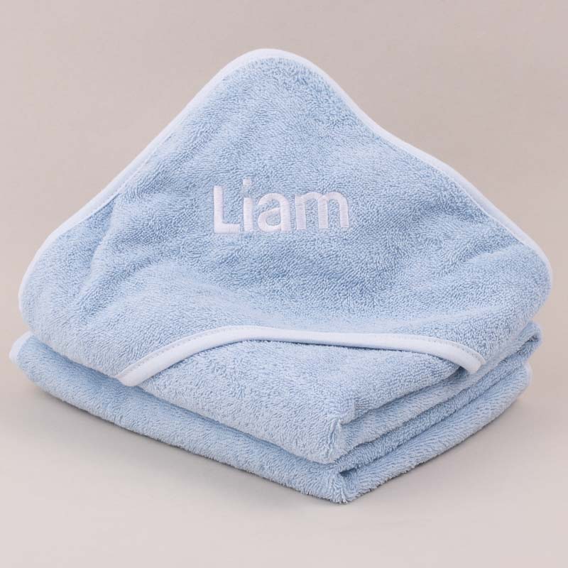 Personalised blue baby hooded towel gift for boys embroidered with name Liam.