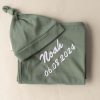 Olive green Swaddle and Beanie personalised with the name Noah.