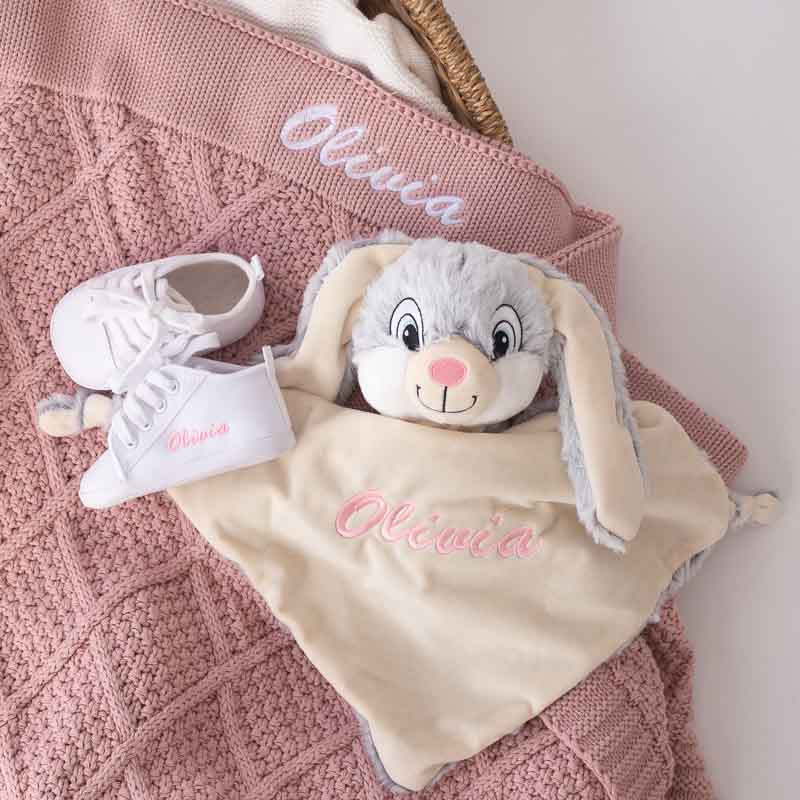 Personalised blush pink knitted diamond baby blanket, bunny comforter and white shoes newborn girl gift.