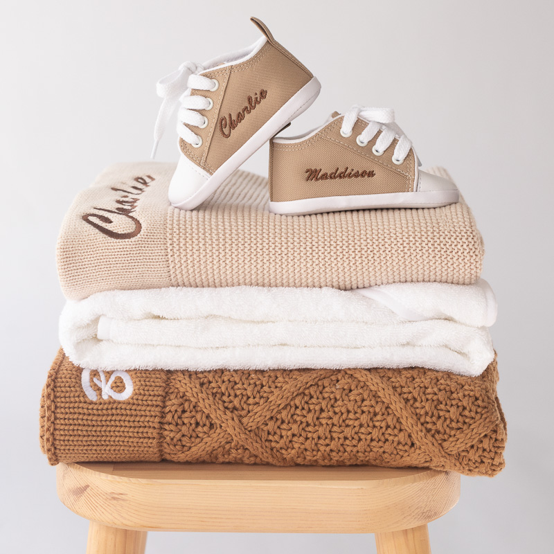 Baby blankets, towel and shoes personalised with baby name embroidery.