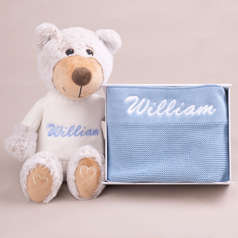 Teddy bear and baby blanket with the name William.